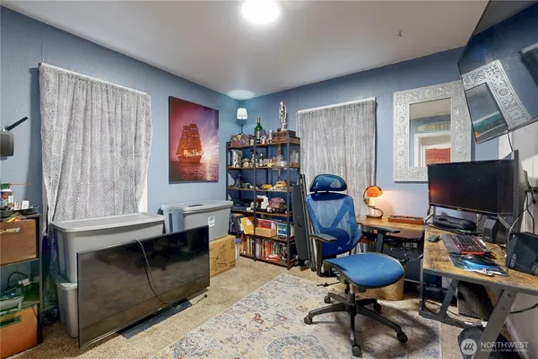 a workspace with furniture and a window