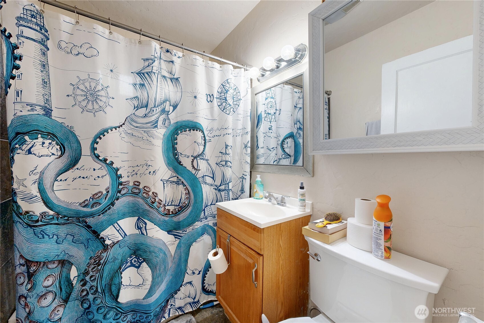 530 Southwest 4th Street College Place, WA 99324 - Photo 20 of 30 a bathroom with a sink mirror vanity and toilet