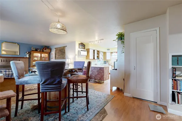a view of a livingroom with furniture and a workspace
