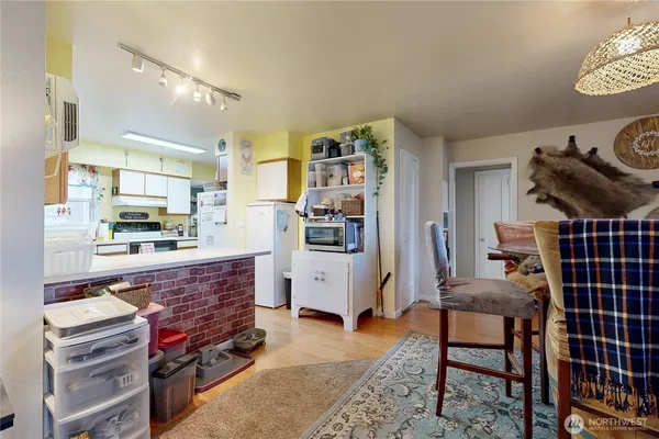 a kitchen with a refrigerator and a counter top space
