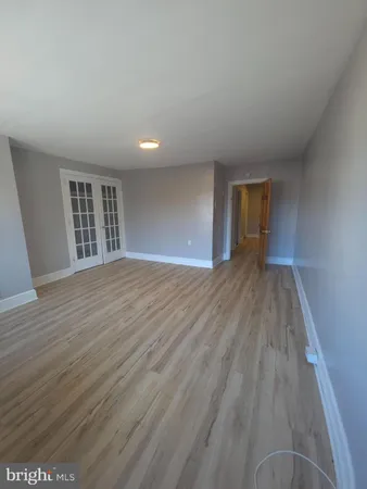 a large bathroom with a granite countertop sink a washer and dryer