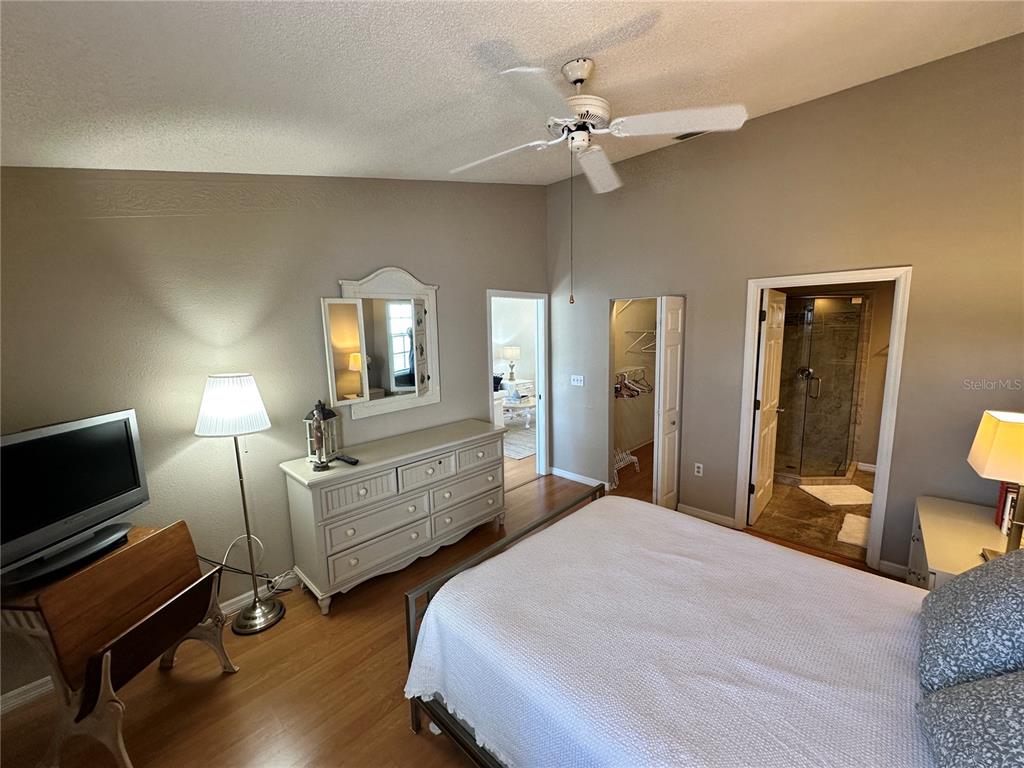 517 Woodstork Circle Bradenton, FL 34209 - Photo 13 of 34 a bedroom with two beds and a mirror