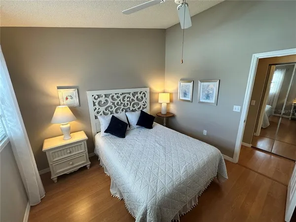 a bedroom with a bed and a couch