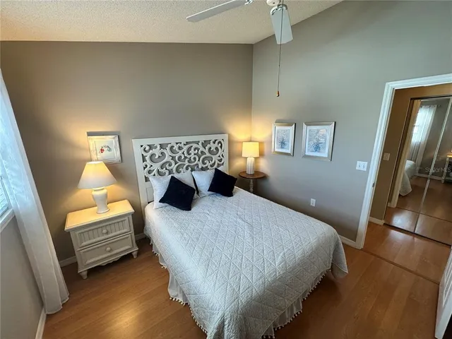 a bedroom with a bed and a couch