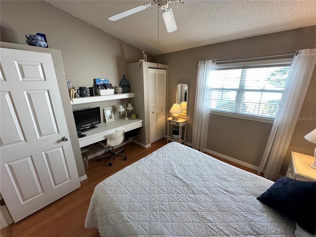 517 Woodstork Circle Bradenton, FL 34209 - Photo 19 of 34 a bedroom with a bed and a window