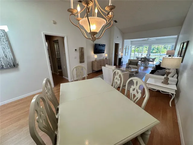 a view of a livingroom with furniture window and wooden floor