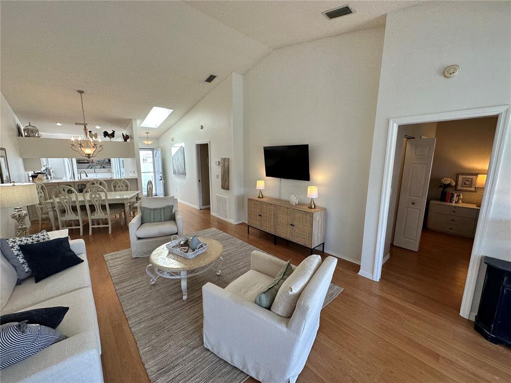 517 Woodstork Circle Bradenton, FL 34209 - Photo 7 of 34 a living room with furniture and a flat screen tv