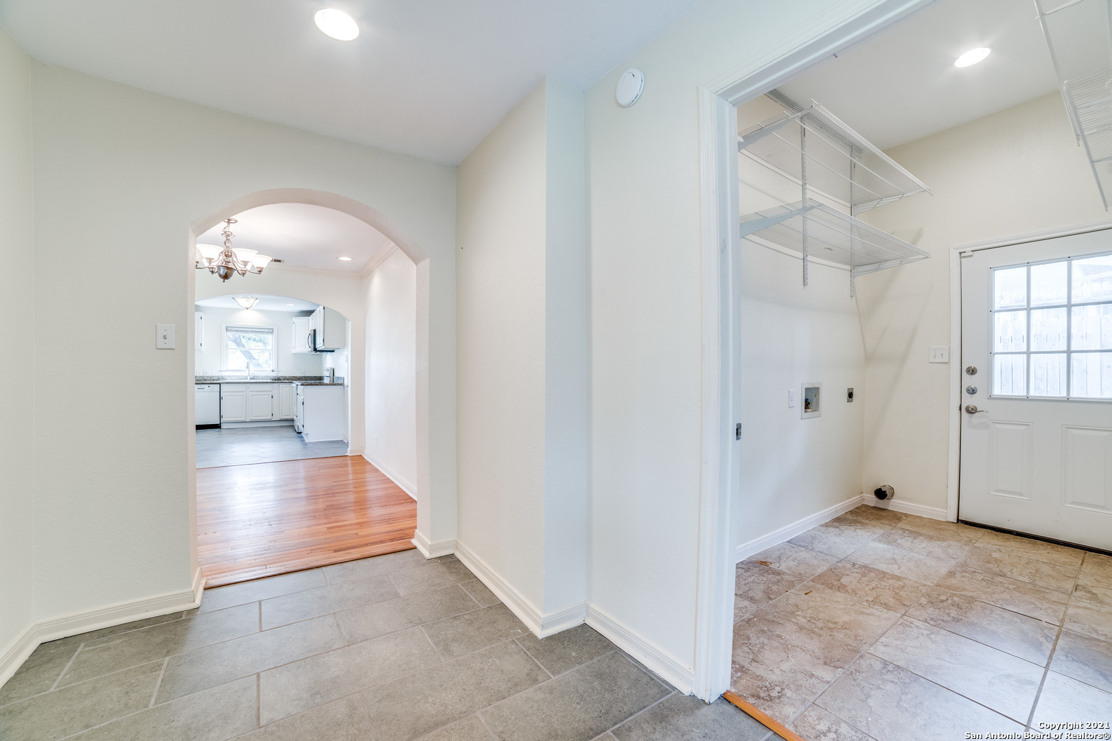 1149 Garraty Road San Antonio, TX 78209 - Photo 11 of 25 a view of a hallway view with wooden floor and staircase