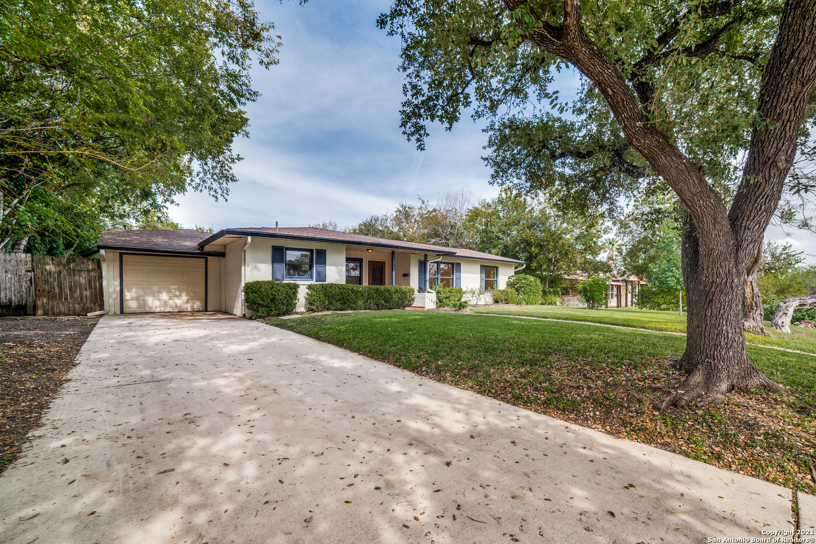 1149 Garraty Road San Antonio, TX 78209 - Photo 2 of 25 a front view of a house with yard and green space