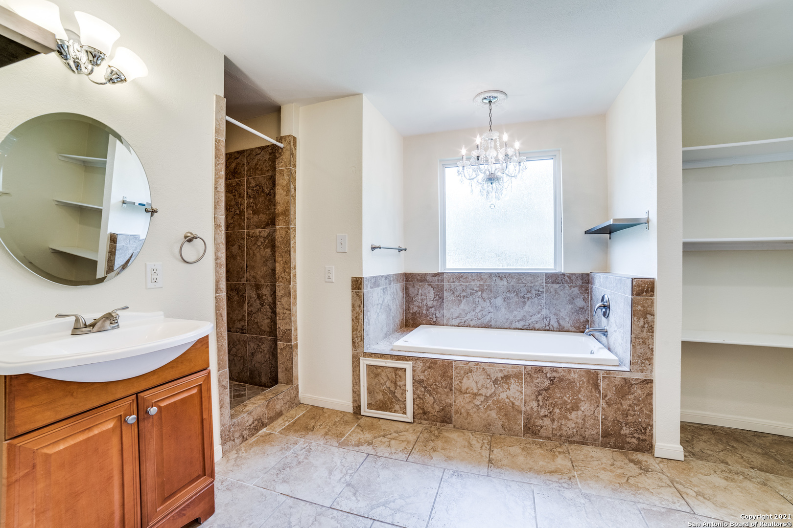 1149 Garraty Road San Antonio, TX 78209 - Photo 21 of 25 a spacious bathroom with a tub sink and mirror