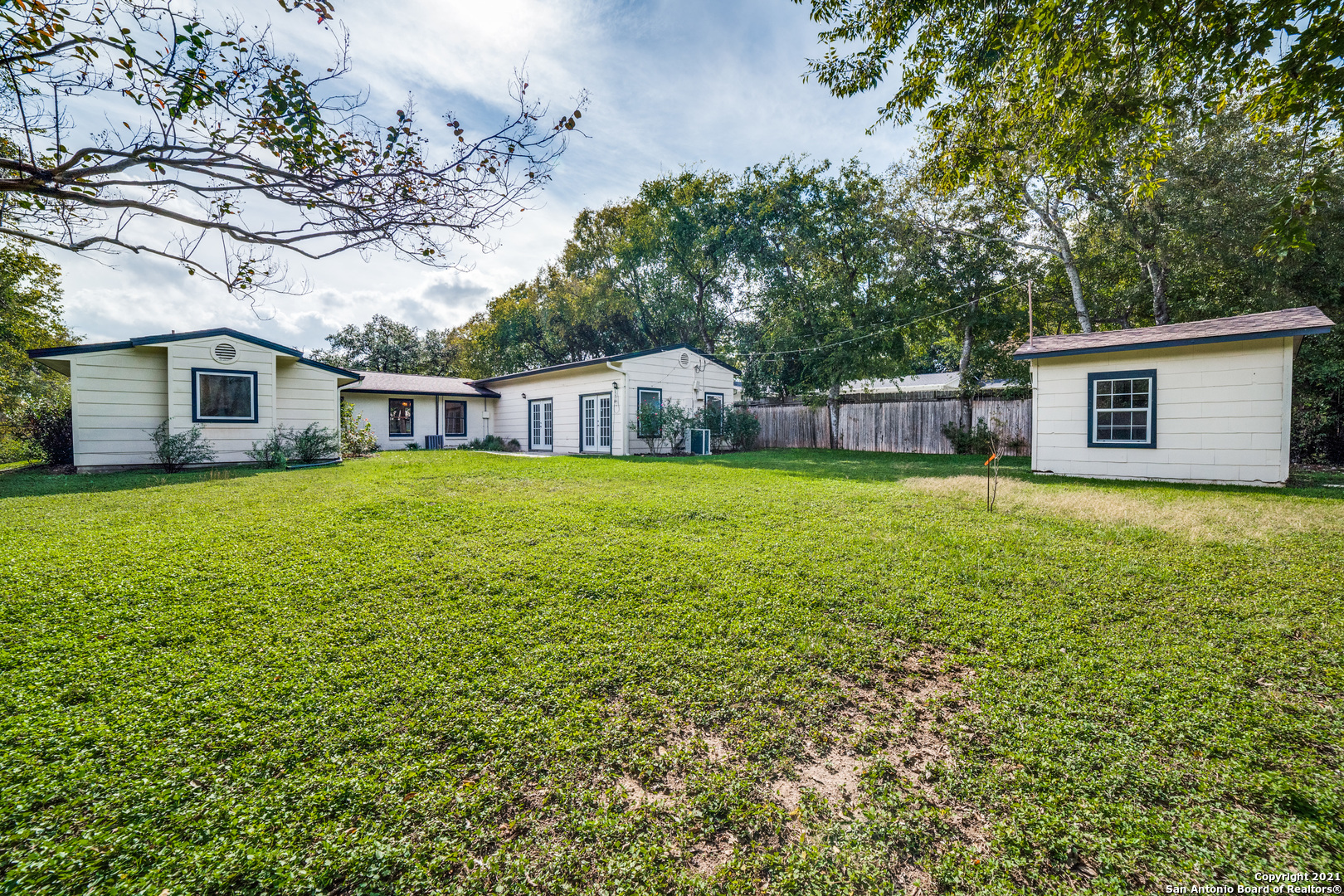1149 Garraty Road San Antonio, TX 78209 - Photo 24 of 25 a view of a house with a yard and sitting area