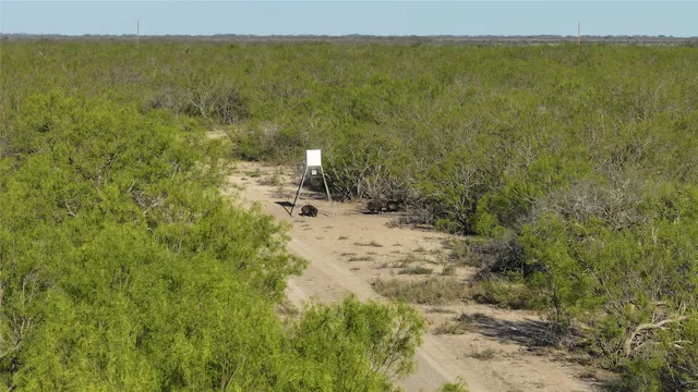 a view of a field with an outdoor space