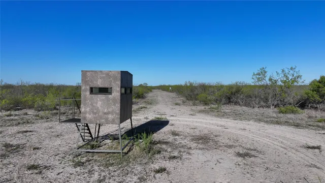a view of a lake with houses in the back