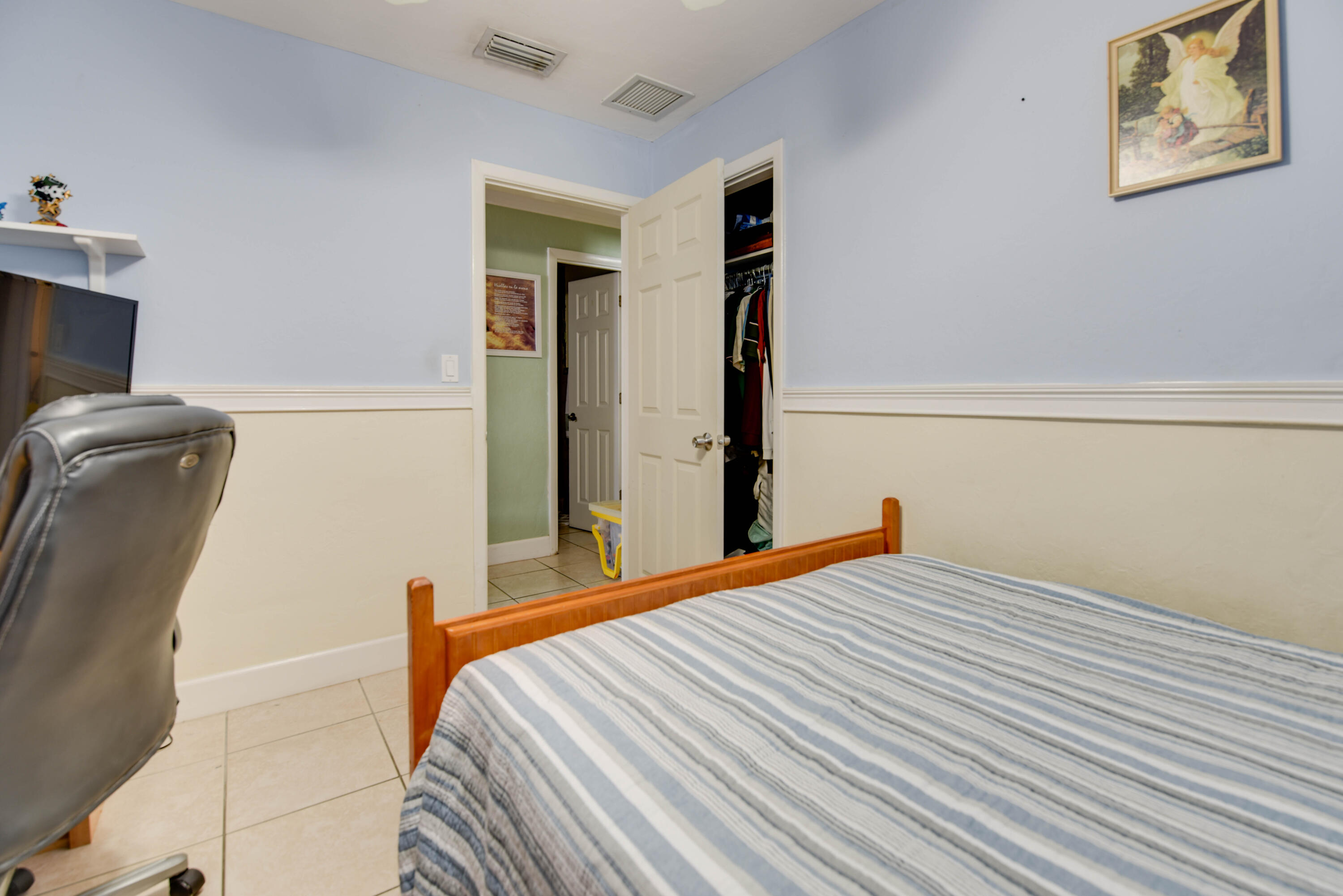 1524 5th Street Key West, FL 33040 - Photo 17 of 31 a bedroom with a bed and wooden floor