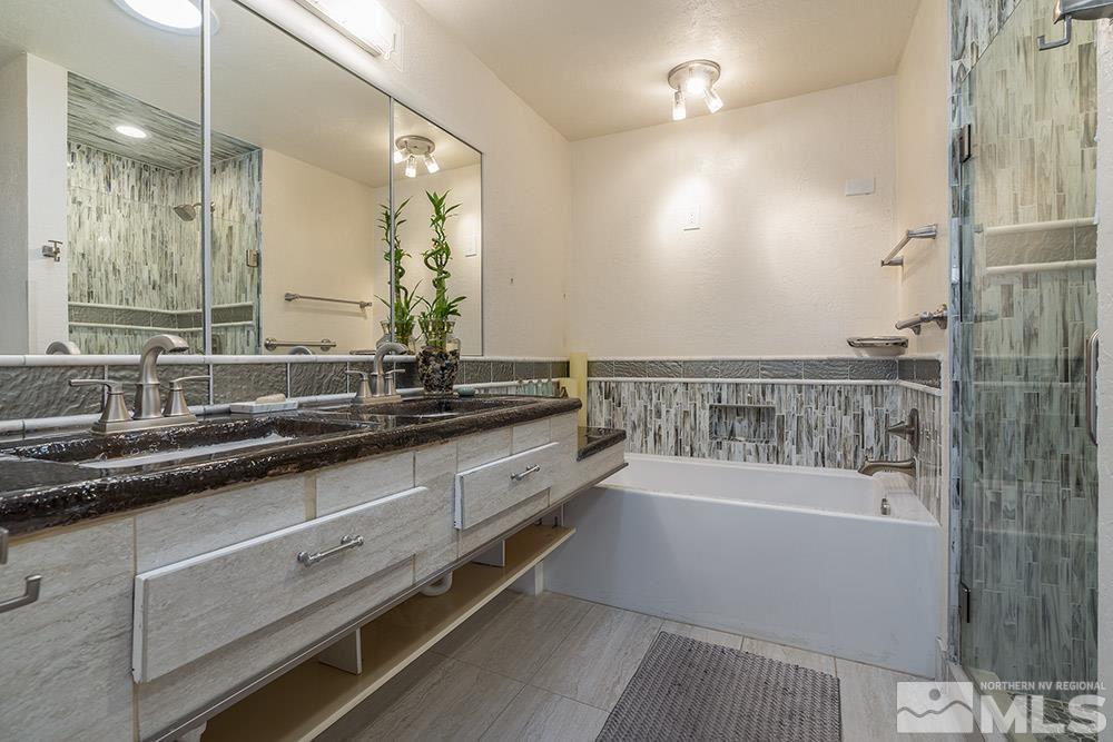 2012 Tremont Lane Reno, NV 89509 - Photo 13 of 20 a bathroom with a bathtub and a sink