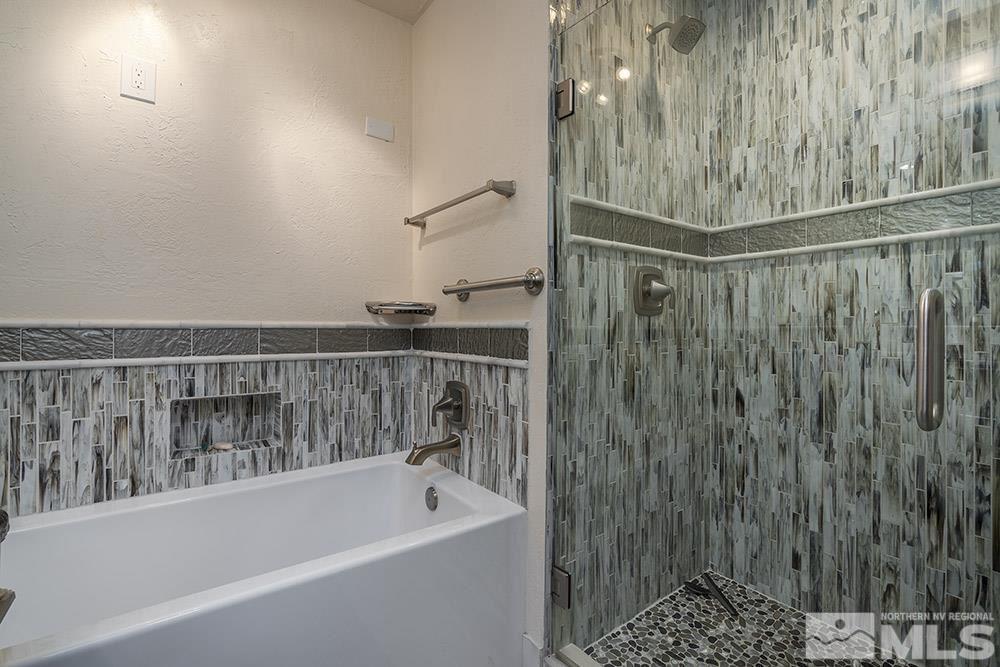 2012 Tremont Lane Reno, NV 89509 - Photo 14 of 20 a bathroom with a bathtub and shower