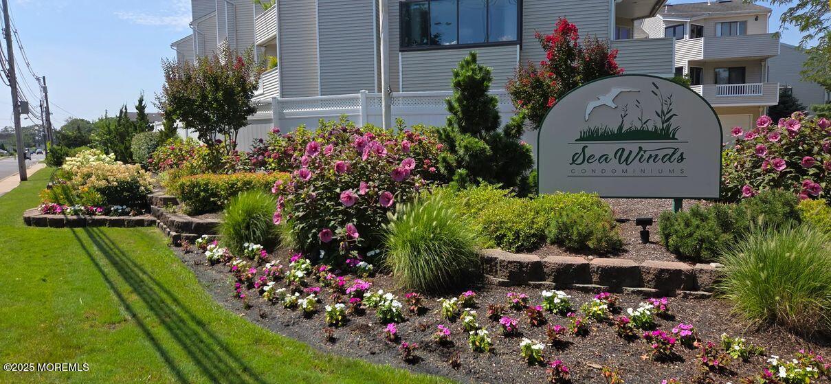 5 Sea Breeze Court Long Branch, NJ 07740 - Photo 1 of 28 a sign that is in front of flowers