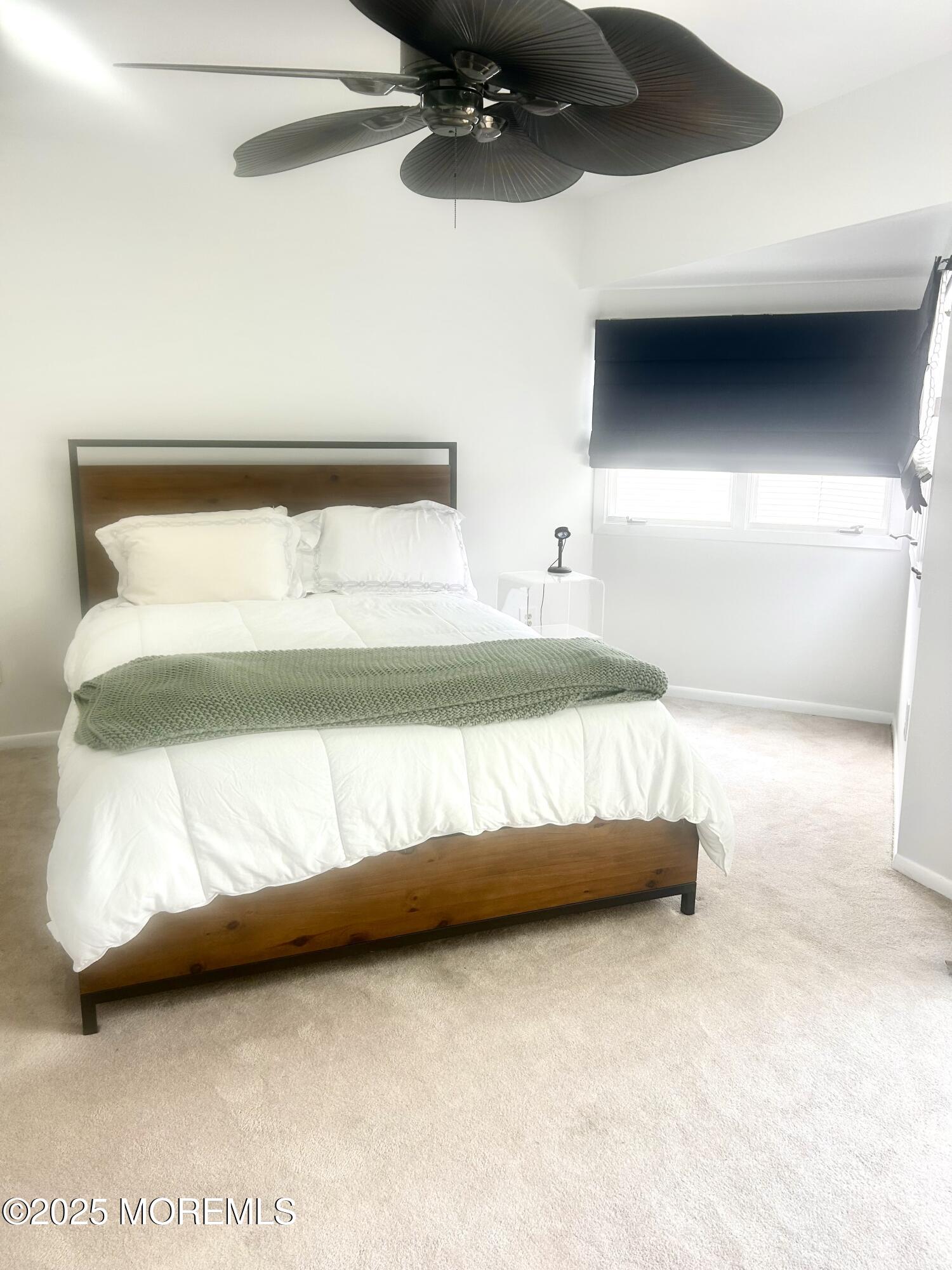 5 Sea Breeze Court Long Branch, NJ 07740 - Photo 17 of 28 a bedroom with a bed and a night stand