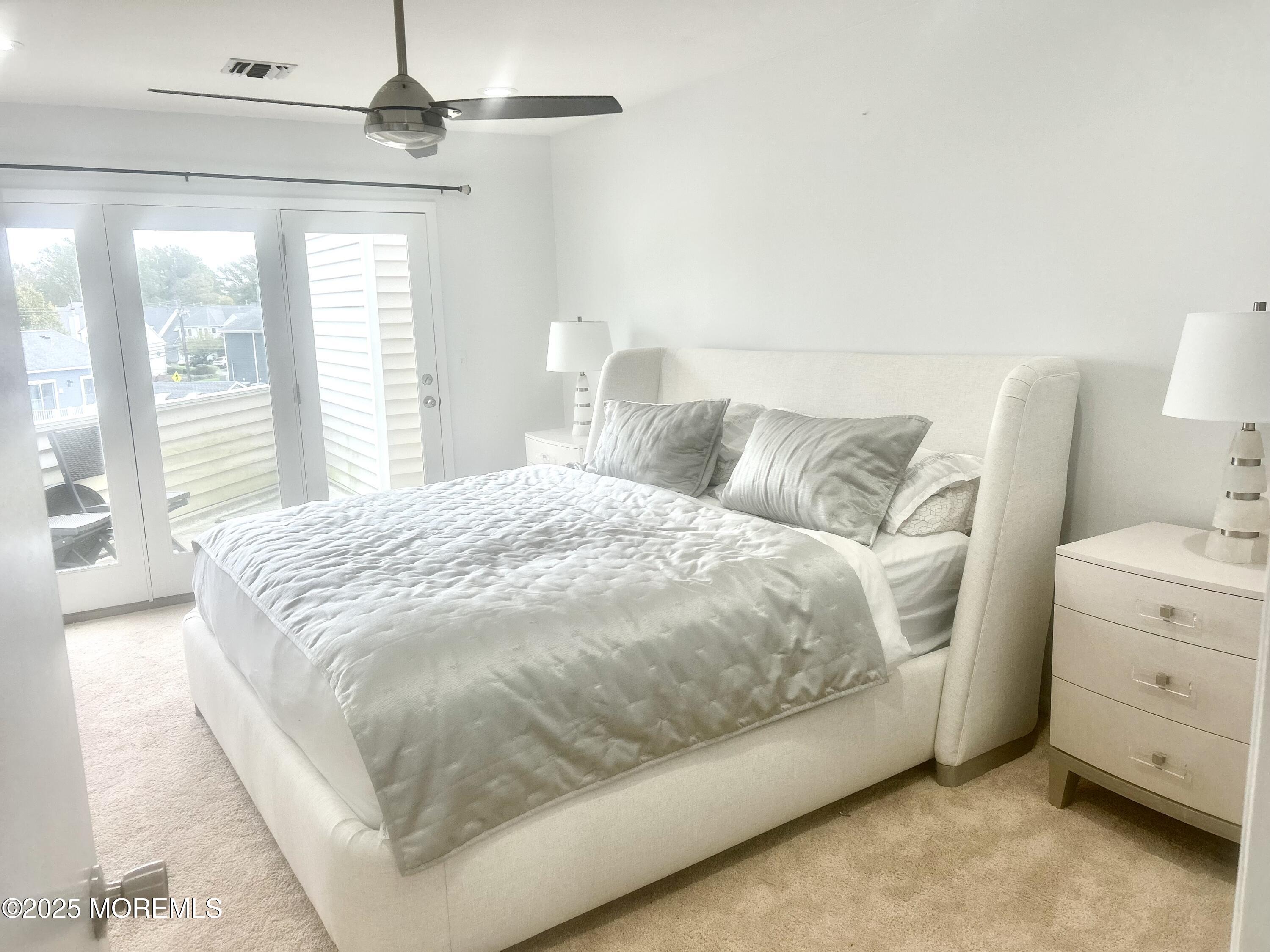 5 Sea Breeze Court Long Branch, NJ 07740 - Photo 19 of 28 a bedroom with a bed and a window