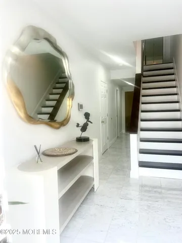 a bathroom with a sink a mirror and tub