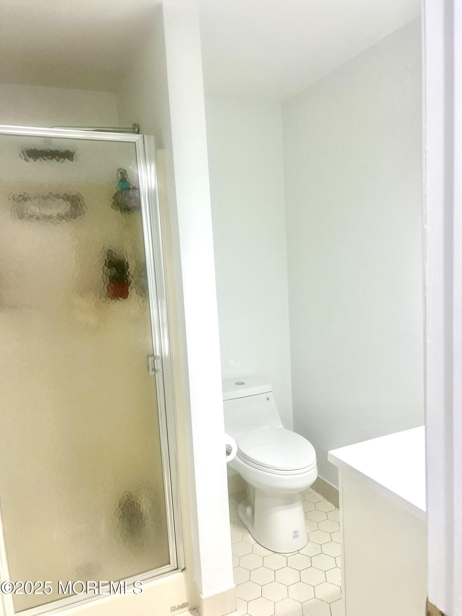 5 Sea Breeze Court Long Branch, NJ 07740 - Photo 8 of 28 a bathroom with a toilet and a shower