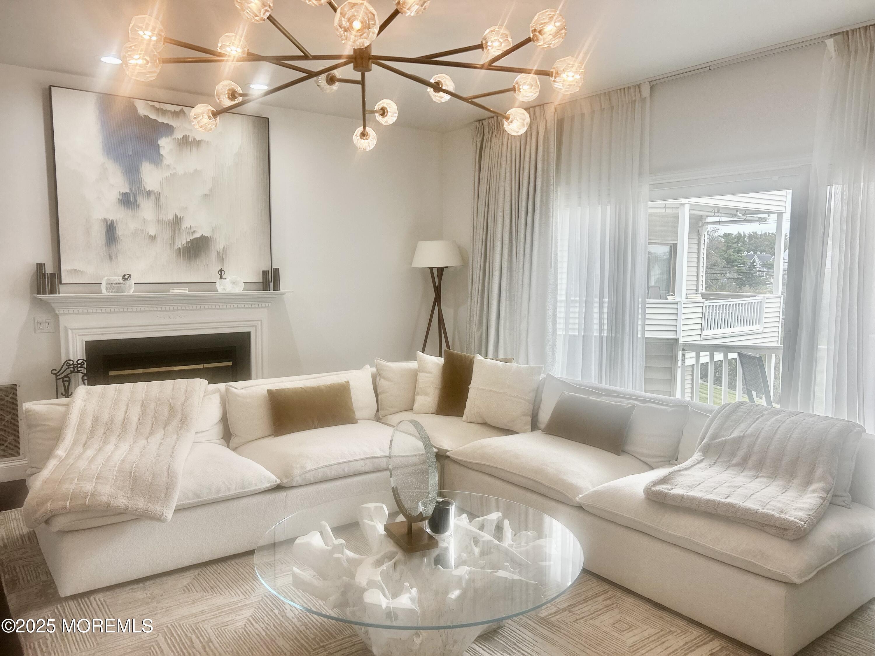 5 Sea Breeze Court Long Branch, NJ 07740 - Photo 9 of 28 a living room with furniture and a large window