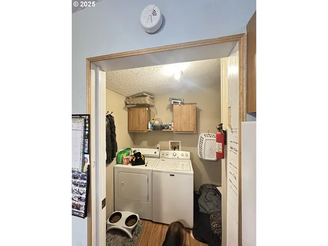 a room with cabinets and washer