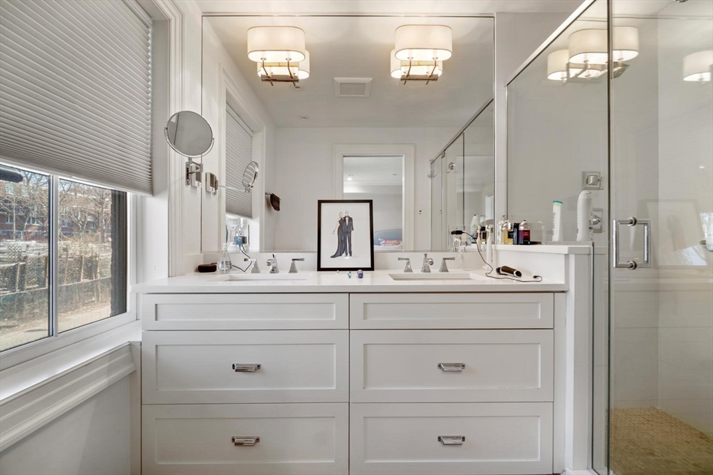 55 Dwight Street, Unit 1 Boston, MA 02118 - Photo 11 of 15 a bathroom with a sink mirror and vanity