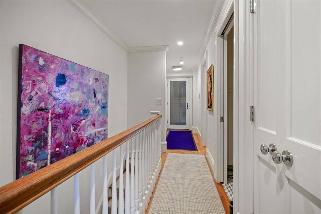 55 Dwight Street, Unit 1 Boston, MA 02118 - Photo 8 of 15 a view of a hallway with wooden floor and stairs