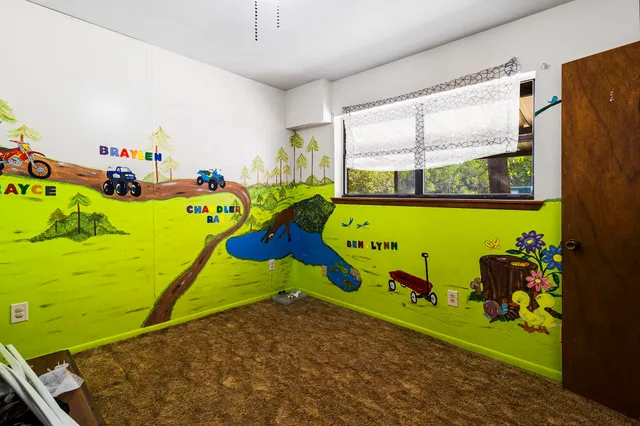 an empty room with window and garage