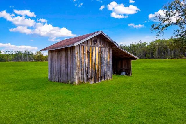 a view of a house with a big yard