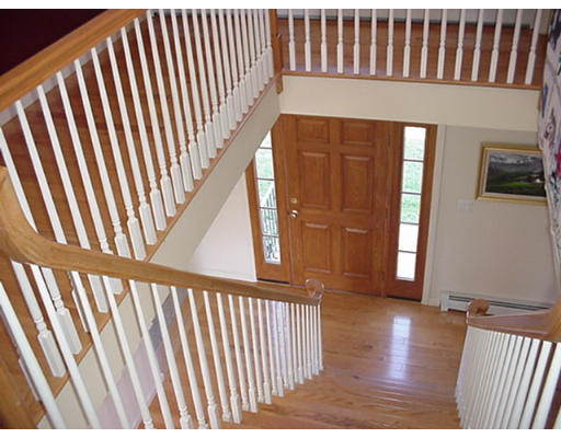 243 Thompson Road Princeton, MA 01541 - Photo 6 of 7 a view of a hallway with wooden floor and windows