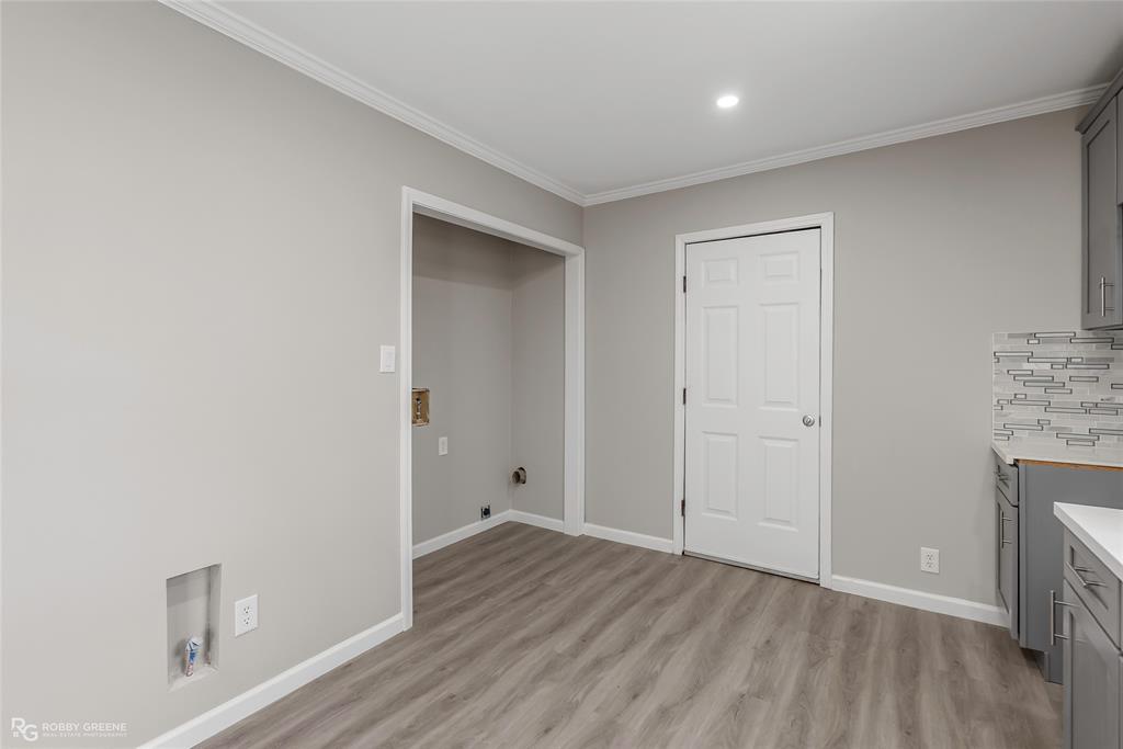 3112 Standard Oil Road Shreveport, LA 71108 - Photo 11 of 24 an empty room with wooden floor and closet