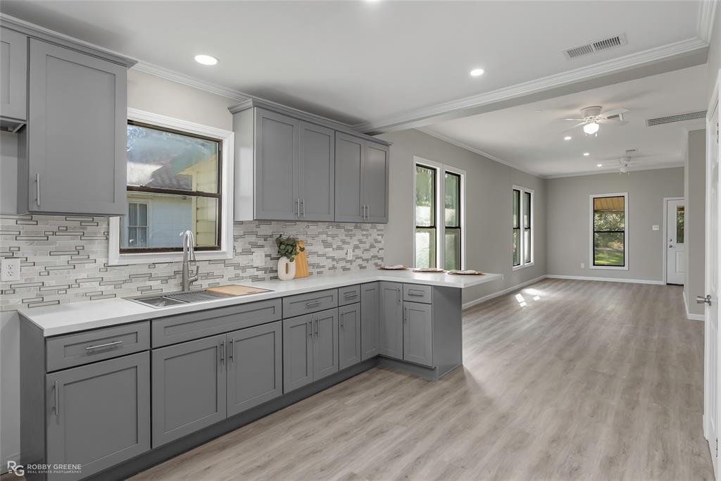 3112 Standard Oil Road Shreveport, LA 71108 - Photo 12 of 24 a kitchen with sink and cabinets