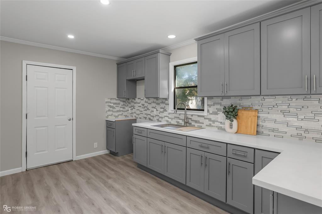 3112 Standard Oil Road Shreveport, LA 71108 - Photo 10 of 24 a kitchen with a sink cabinets and appliances