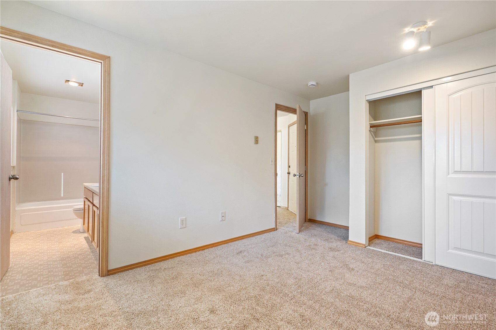 6042 Fauntleroy Way Southwest Seattle, WA 98136 - Photo 11 of 21 an empty room with windows and closet
