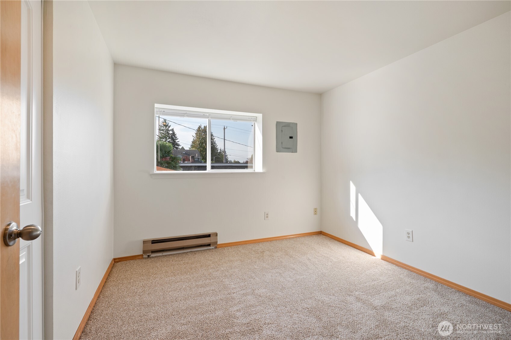 6042 Fauntleroy Way Southwest Seattle, WA 98136 - Photo 12 of 21 an empty room with windows