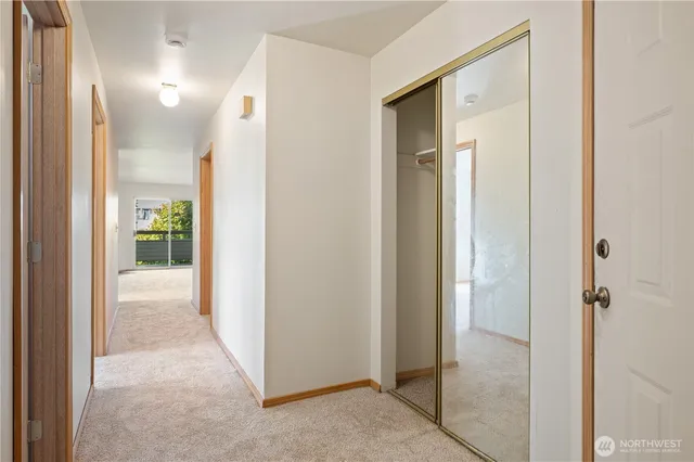 a view of a bathroom from a hallway