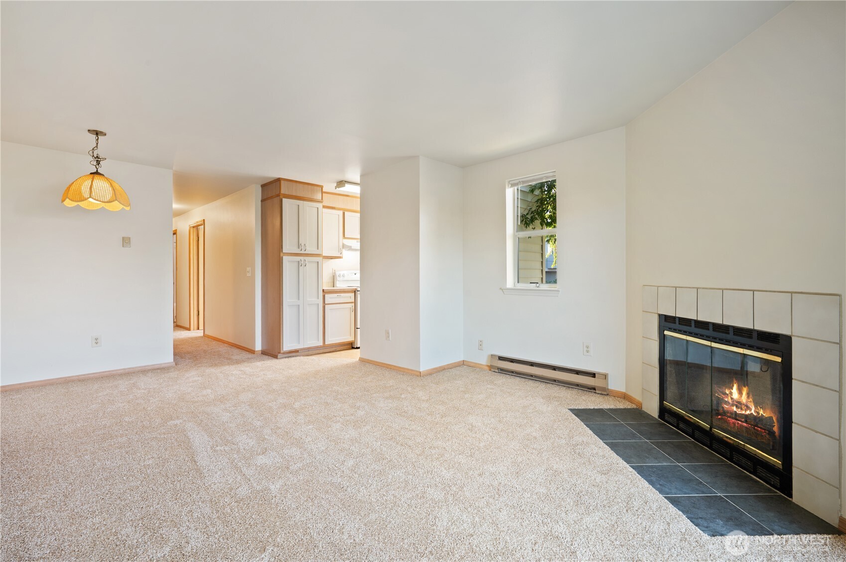 6042 Fauntleroy Way Southwest Seattle, WA 98136 - Photo 8 of 21 a view of empty room with a fireplace and fan