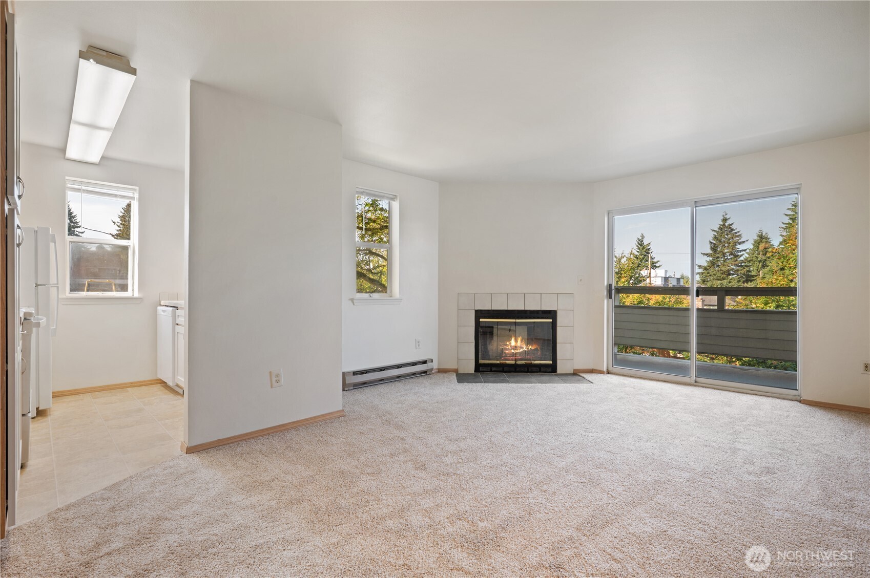 6042 Fauntleroy Way Southwest Seattle, WA 98136 - Photo 9 of 21 an empty room with furniture and a fireplace