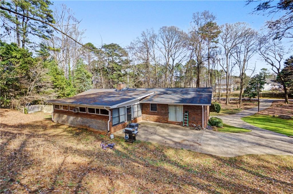 5075 Deen Road Marietta, GA 30066 - Photo 11 of 37 a view of a house with a yard patio and wooden fence