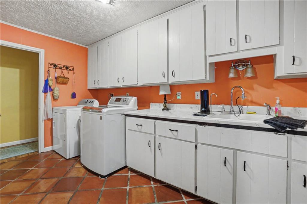 5075 Deen Road Marietta, GA 30066 - Photo 25 of 37 a kitchen with white cabinets and sink