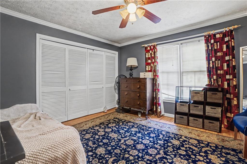 5075 Deen Road Marietta, GA 30066 - Photo 26 of 37 a bedroom with a bed and wooden floor