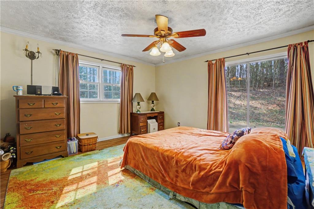 5075 Deen Road Marietta, GA 30066 - Photo 29 of 37 a bed sitting in a bedroom next to a window