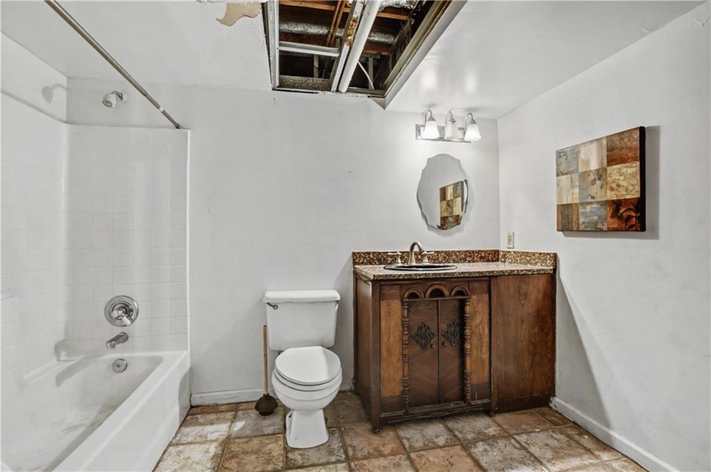5075 Deen Road Marietta, GA 30066 - Photo 37 of 37 a bathroom with a toilet a sink and a bathtub