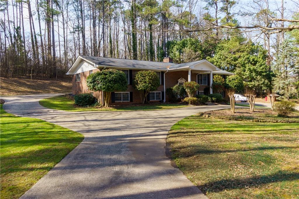5075 Deen Road Marietta, GA 30066 - Photo 4 of 37 a swimming pool with outdoor seating and yard