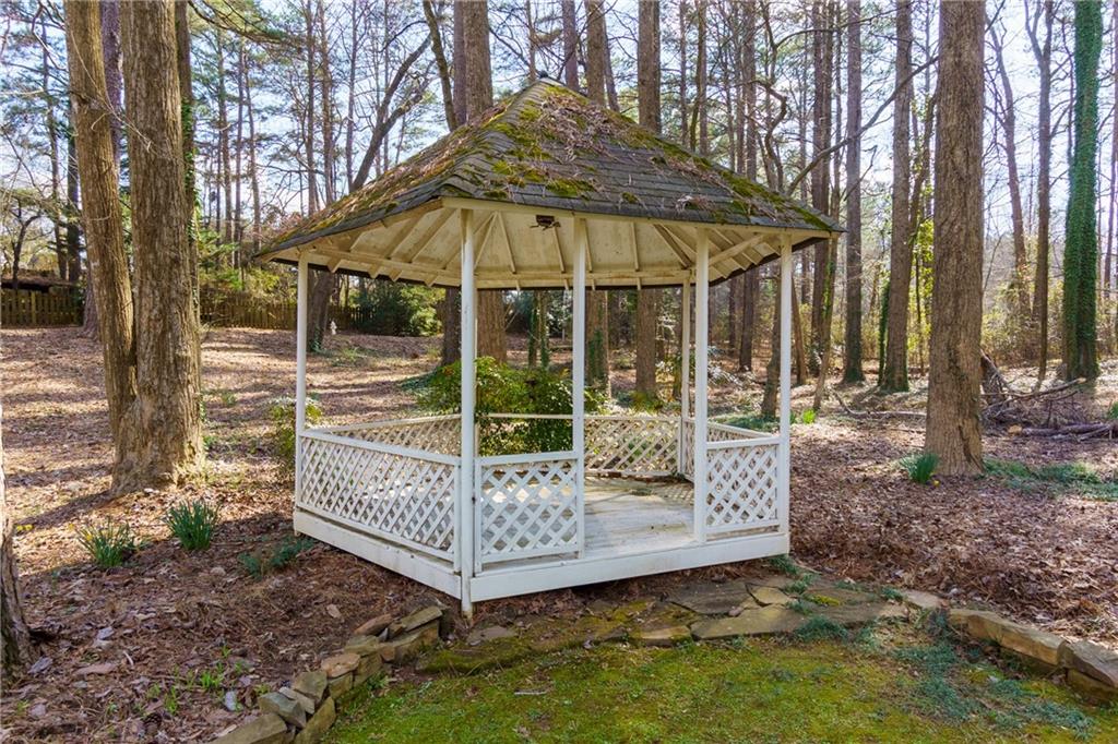 5075 Deen Road Marietta, GA 30066 - Photo 5 of 37 a view of a small house with backyard and sitting area