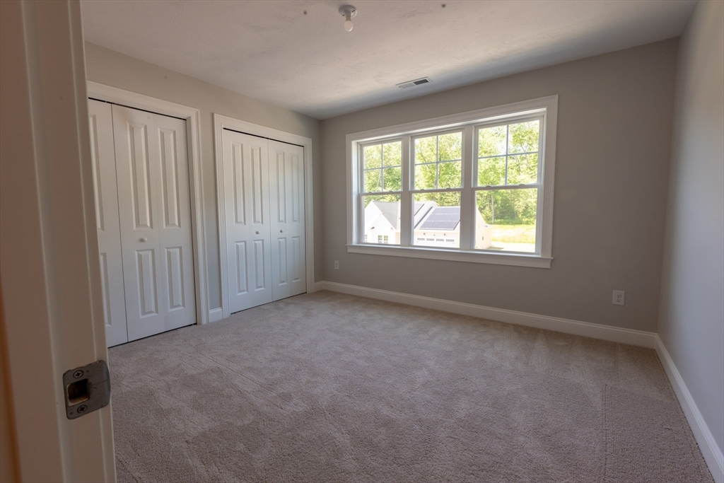 145 Mantell Road Uxbridge, MA 01569 - Photo 11 of 13 an empty room with windows