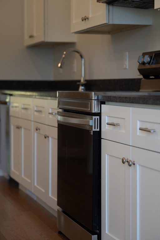 145 Mantell Road Uxbridge, MA 01569 - Photo 13 of 13 a kitchen with a stove and cabinets