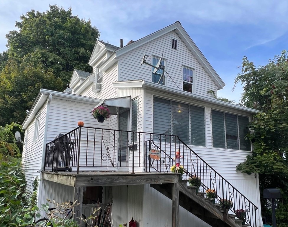 9 Dervin Place Clinton, MA 01510 - Photo 1 of 20 a view of a house with wooden fence